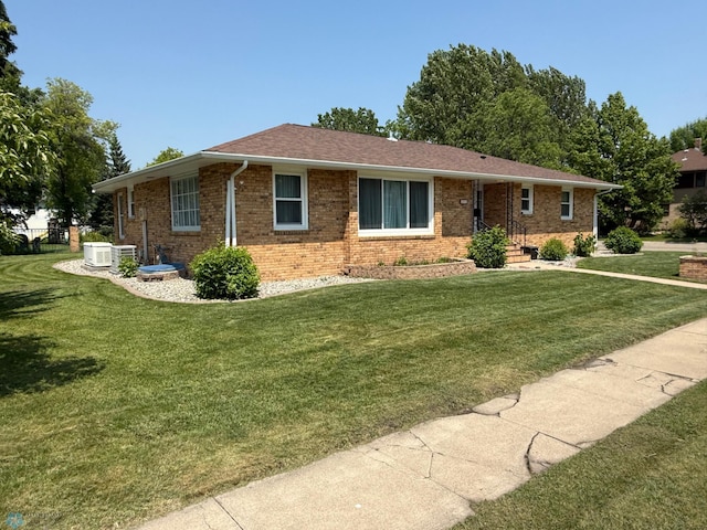 409 1st Ave E, Ada, MN 56510 - ranch-style house featuring a front lawn and brick siding