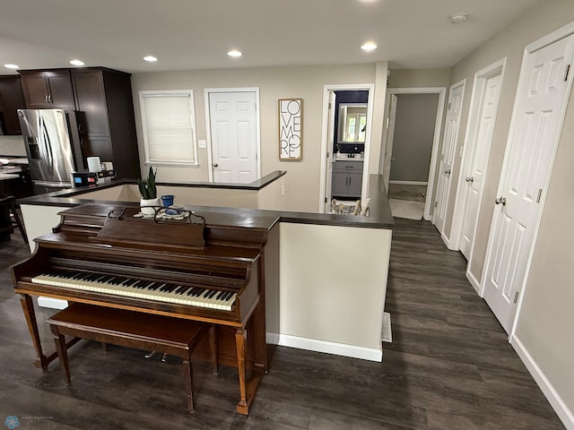 409 1st Ave E, Ada, MN 56510 - kitchen with recessed lighting, stainless steel fridge, dark wood finished floors, dark brown cabinets, and dark countertops