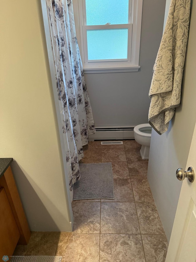 409 1st Ave E, Ada, MN 56510 - bathroom with a baseboard radiator and a shower with shower curtain