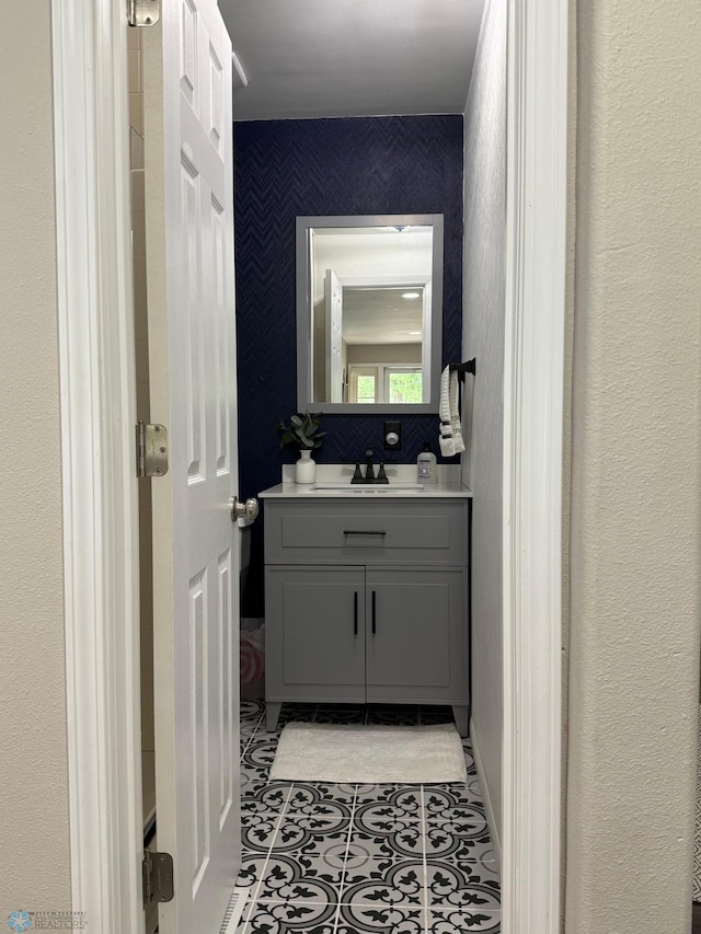 409 1st Ave E, Ada, MN 56510 - bathroom with vanity and tile patterned flooring