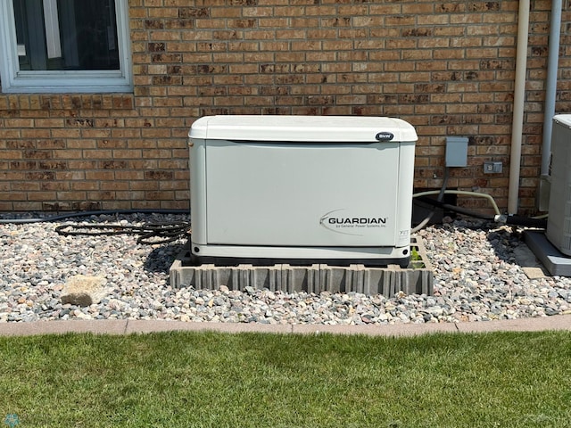 409 1st Ave E, Ada, MN 56510 - exterior view of a power unit and brick siding