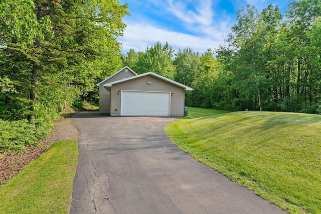 5578 Cloquet Rd, Midway Twp, MN 55810 - view of front of home with a front lawn, a garage, and asphalt driveway