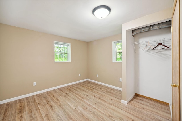 5578 Cloquet Rd, Midway Twp, MN 55810 - unfurnished bedroom with wood finished floors and a closet