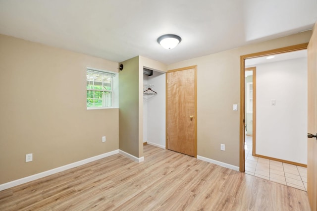 5578 Cloquet Rd, Midway Twp, MN 55810 - unfurnished bedroom with light wood-style flooring and a closet