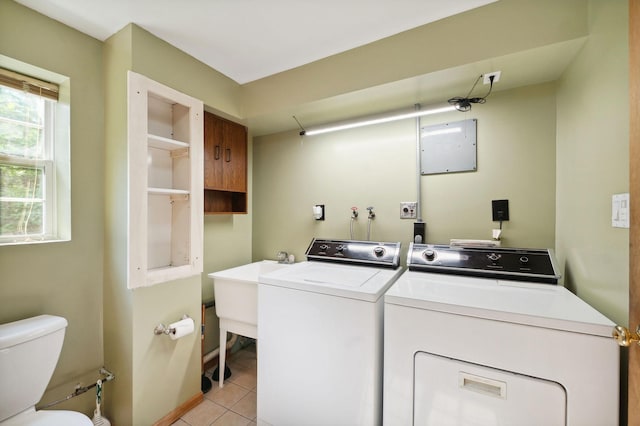 5578 Cloquet Rd, Midway Twp, MN 55810 - washroom featuring washing machine and clothes dryer and light tile patterned floors