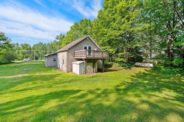 5578 Cloquet Rd, Midway Twp, MN 55810 - rear view of property featuring a shed, a wooden deck, a yard, and view of scattered trees