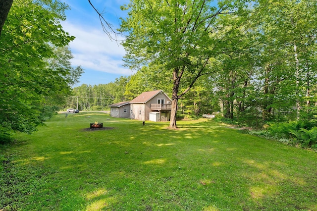 5578 Cloquet Rd, Midway Twp, MN 55810 - view of green lawn with a deck and a fire pit