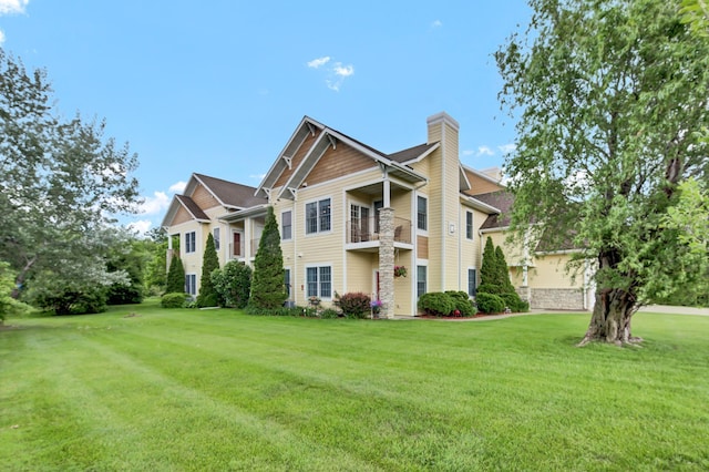 755 Hickory Way Unit 2, Lake City, MN 55041 - view of front of home featuring a chimney and a front lawn