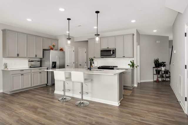17983 Giants Way, Lakeville, MN 55044 - kitchen with stainless steel appliances, gray cabinetry, tasteful backsplash, dark wood-style floors, and recessed lighting