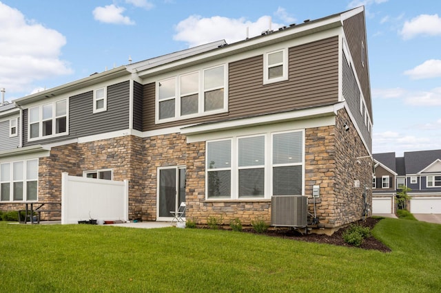 17983 Giants Way, Lakeville, MN 55044 - back of house featuring stone siding and a lawn