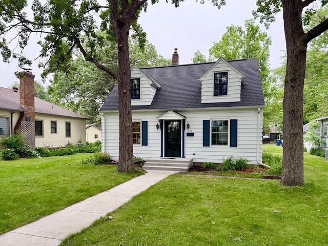 332 Riverside Dr NE, Saint Cloud, MN 56304 - cape cod home with a front lawn, a chimney, and a shingled roof