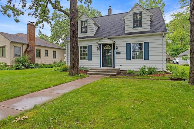 332 Riverside Dr NE, Saint Cloud, MN 56304 - cape cod house with a front yard and roof with shingles