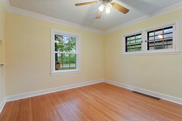 332 Riverside Dr NE, Saint Cloud, MN 56304 - empty room featuring ornamental molding, wood finished floors, a ceiling fan, and a textured ceiling
