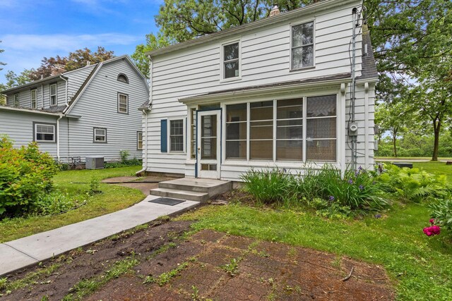 332 Riverside Dr NE, Saint Cloud, MN 56304 - dutch colonial featuring a sunroom, a front yard, and a chimney