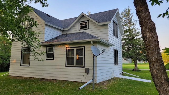 112 240th St N, Eglon Twp, MN 56549 - view of side of property with roof with shingles and a lawn