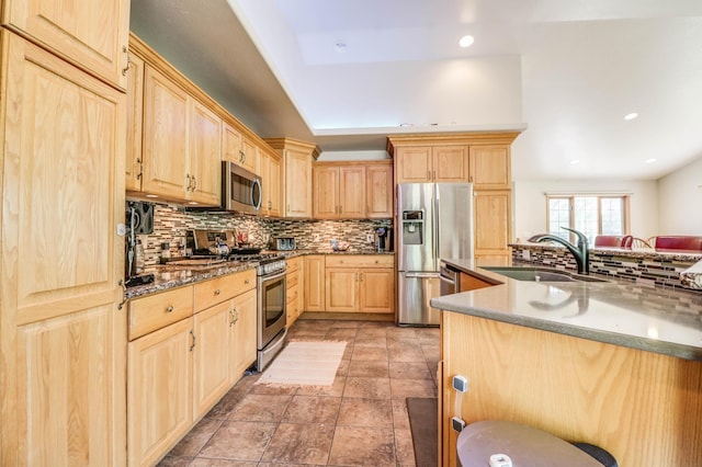 2607 Forest View Dr NE, Bemidji, MN 56601 - kitchen featuring stainless steel appliances, light brown cabinets, a sink, backsplash, and recessed lighting