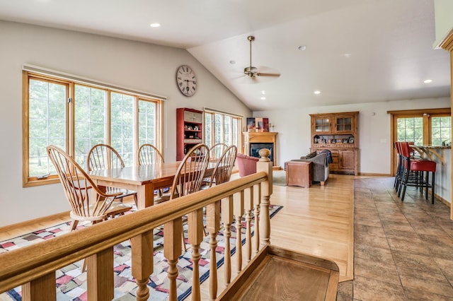 2607 Forest View Dr NE, Bemidji, MN 56601 - dining area featuring ceiling fan, lofted ceiling, recessed lighting, a glass covered fireplace, and baseboards