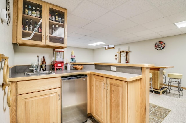 2607 Forest View Dr NE, Bemidji, MN 56601 - kitchen with stainless steel refrigerator, light brown cabinets, a sink, a peninsula, and glass insert cabinets