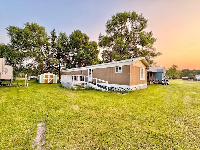 2683 22nd St NW Lot 8, Baudette, MN 56623 - back of property at dusk with a storage shed and a yard