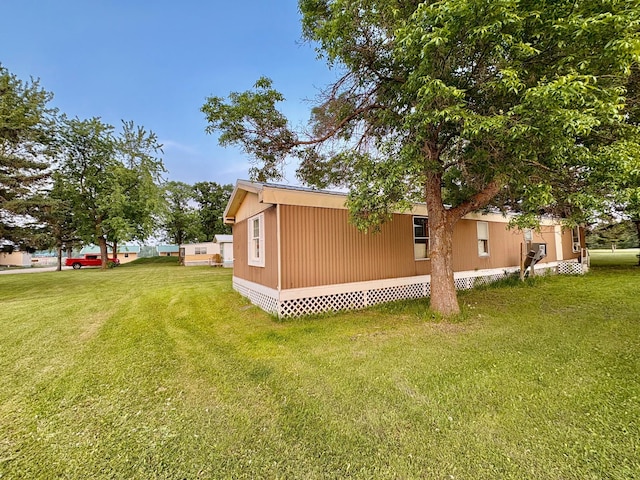 2683 22nd St NW Lot 8, Baudette, MN 56623 - view of side of home with a lawn