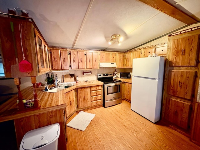 2683 22nd St NW Lot 8, Baudette, MN 56623 - kitchen with electric stove, freestanding refrigerator, under cabinet range hood, vaulted ceiling, and light countertops