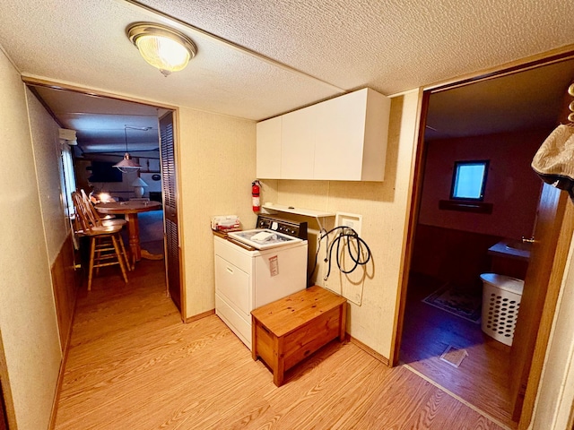 2683 22nd St NW Lot 8, Baudette, MN 56623 - hallway with washer / clothes dryer, light wood finished floors, and a textured ceiling