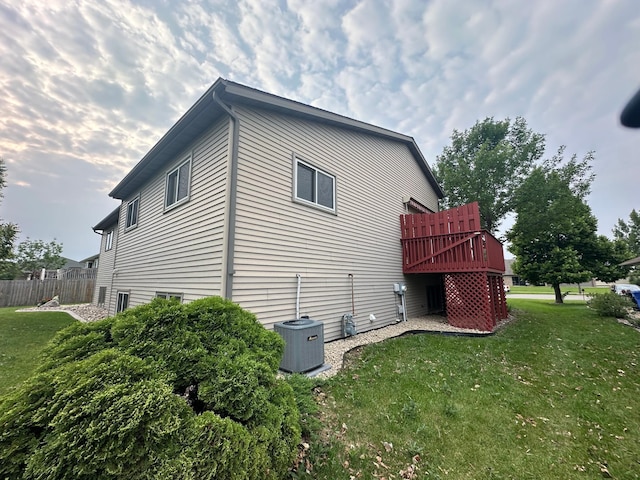3211 30th Ave S, Fargo, ND 58103 - view of home's exterior featuring a central AC unit and a deck