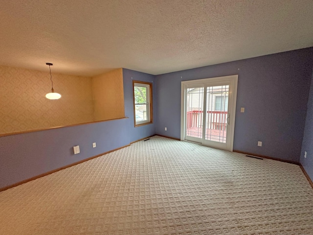 3211 30th Ave S, Fargo, ND 58103 - carpeted spare room with a textured ceiling