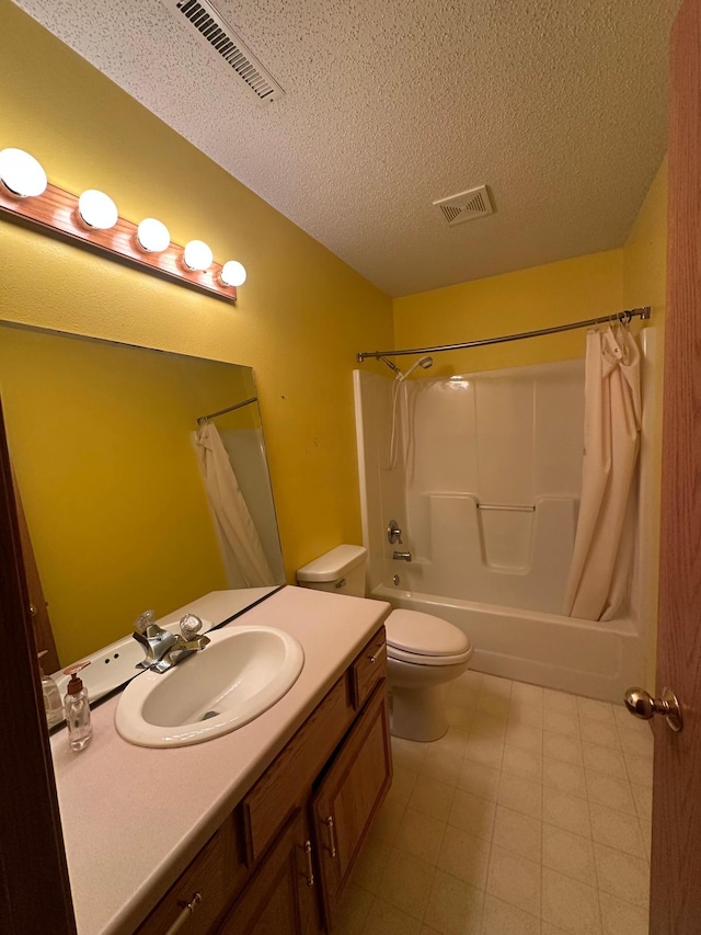 3211 30th Ave S, Fargo, ND 58103 - bathroom featuring vanity, shower / bath combination with curtain, and a textured ceiling