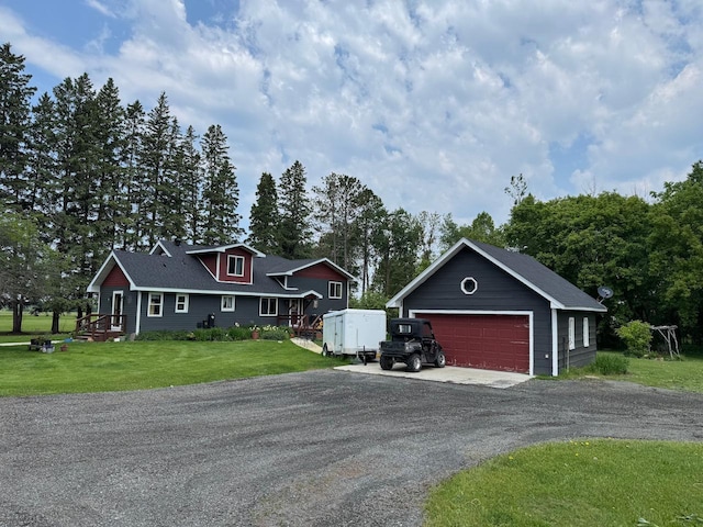 32440 Corlan Rd NE, Langor Twp, MN 56630 - view of front of property with a detached garage, an outbuilding, and a front yard