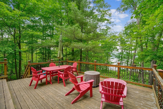 2225 Antler Lake Ct, Milltown, WI 54858 - wooden deck featuring outdoor dining space and view of scattered trees