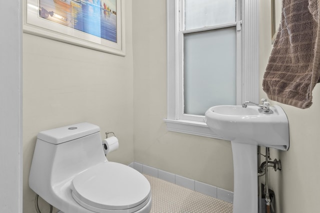 737 5th St E, Saint Paul, MN 55106 - half bathroom with toilet and tile patterned floors
