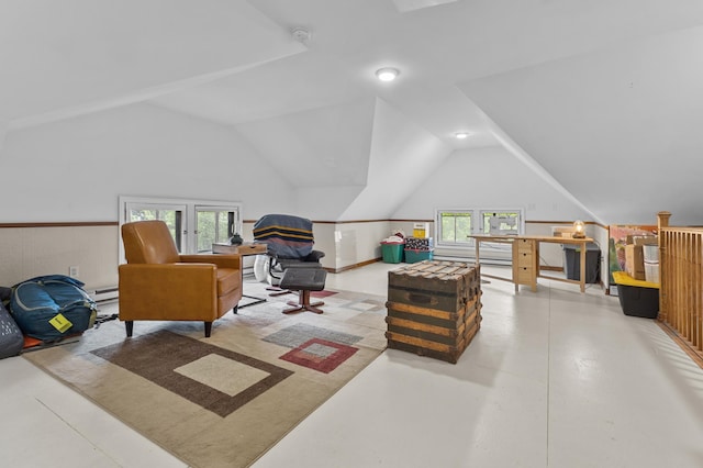 737 5th St E, Saint Paul, MN 55106 - living area featuring lofted ceiling, concrete flooring, and a baseboard heating unit