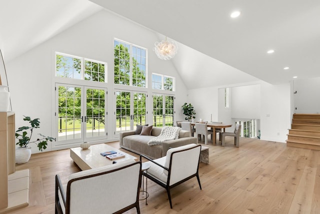 4603 Merilane Ave, Edina, MN 55436 - living room featuring high vaulted ceiling, french doors, light wood-type flooring, recessed lighting, and stairs