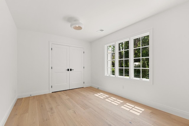 4603 Merilane Ave, Edina, MN 55436 - unfurnished bedroom featuring light wood-type flooring and a closet