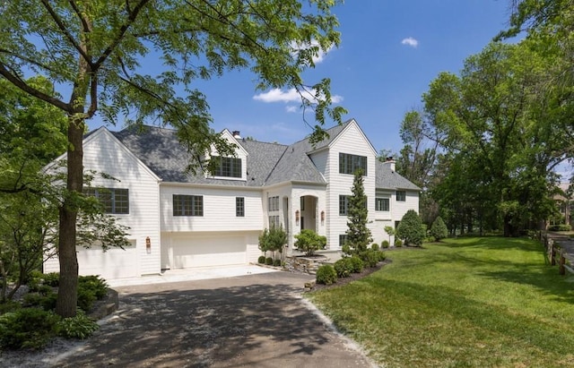 4603 Merilane Ave, Edina, MN 55436 - view of front of house featuring a garage, asphalt driveway, and a front yard