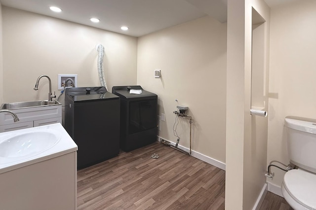 3140 Fremont Ave S, Minneapolis, MN 55408 - laundry area with washing machine and dryer, light wood finished floors, and recessed lighting