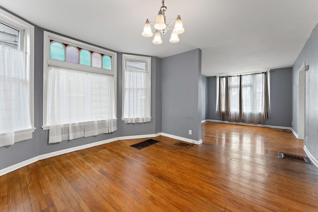 984 Iglehart Ave, Saint Paul, MN 55104 - empty room with a chandelier and wood-type flooring