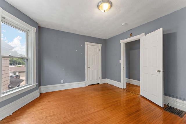 984 Iglehart Ave, Saint Paul, MN 55104 - unfurnished bedroom with light wood-style floors and baseboards
