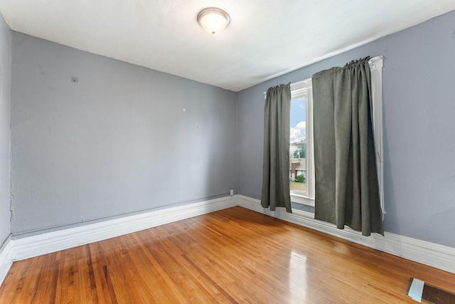 984 Iglehart Ave, Saint Paul, MN 55104 - spare room featuring baseboards and wood finished floors