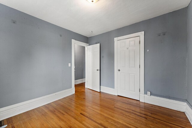 984 Iglehart Ave, Saint Paul, MN 55104 - unfurnished bedroom with baseboards and light wood-style floors
