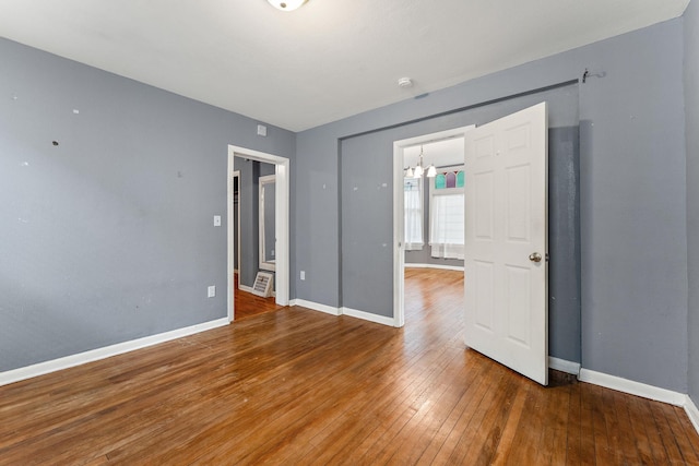 984 Iglehart Ave, Saint Paul, MN 55104 - unfurnished bedroom with hardwood / wood-style floors and a chandelier