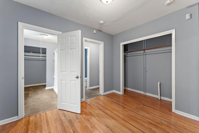 984 Iglehart Ave, Saint Paul, MN 55104 - unfurnished bedroom featuring a closet and light wood-style floors