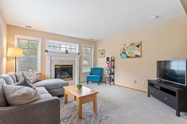 8475 121st Ave N, Champlin, MN 55316 - living area with carpet, healthy amount of natural light, and a glass covered fireplace