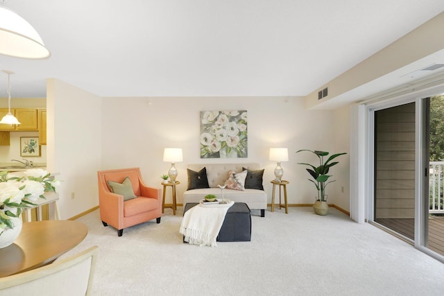 5650 Boone Ave N, New Hope, MN 55428 - living room featuring light carpet and baseboards