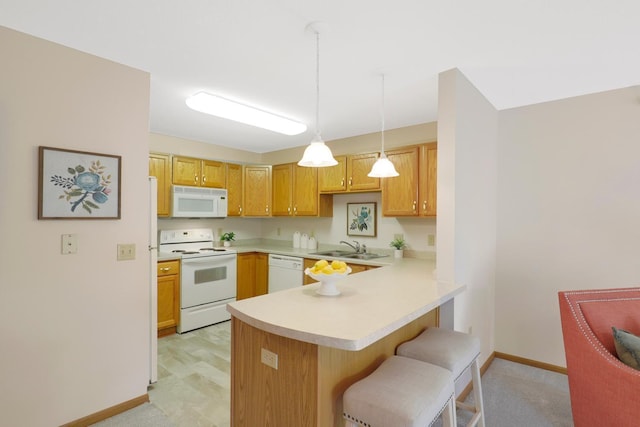 5650 Boone Ave N, New Hope, MN 55428 - kitchen with white appliances, a sink, a peninsula, light countertops, and baseboards