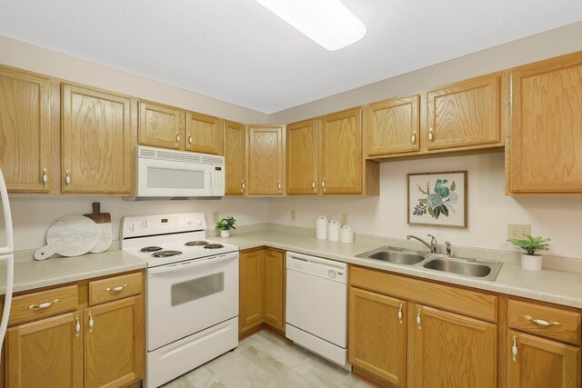5650 Boone Ave N, New Hope, MN 55428 - kitchen with white appliances, a sink, and light countertops