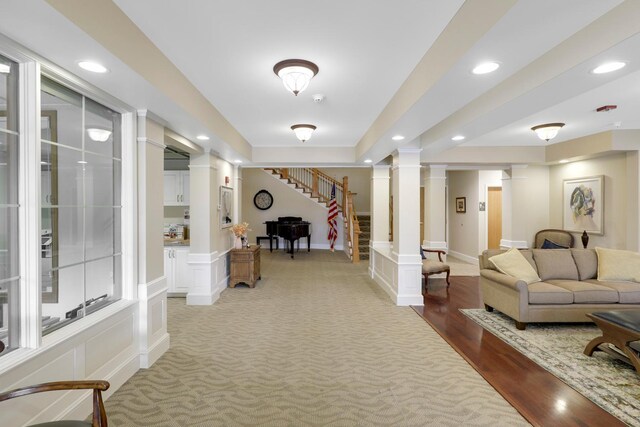 5650 Boone Ave N, New Hope, MN 55428 - corridor with decorative columns, stairway, recessed lighting, a decorative wall, and wood finished floors