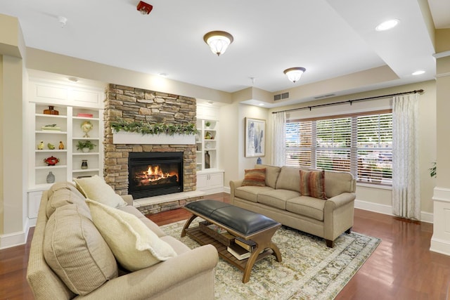 5650 Boone Ave N, New Hope, MN 55428 - living area with a fireplace, baseboards, dark wood-style flooring, built in shelves, and recessed lighting