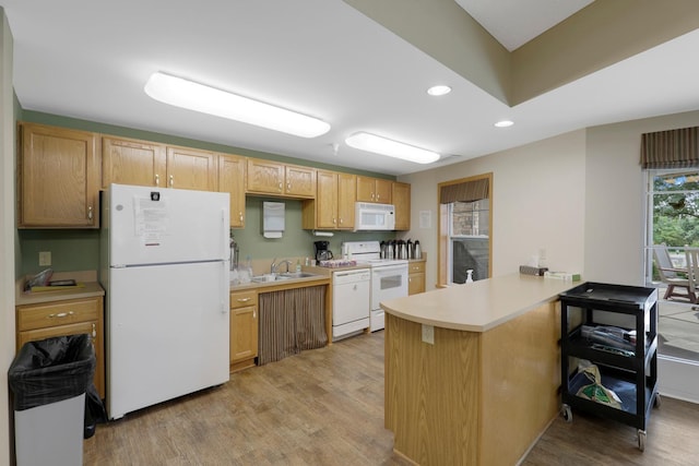 5650 Boone Ave N, New Hope, MN 55428 - kitchen with white appliances, a peninsula, light wood-style floors, light countertops, and recessed lighting